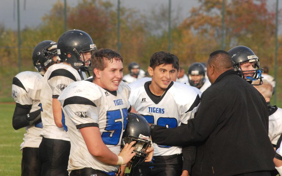 Hohenfels linemen Brett Wade, left, and Ethan Berglund, right, celebrate after Hohenfels' 38-28 Division II semifinal win Saturday, Oct. 26, at Bitburg, Germany. 