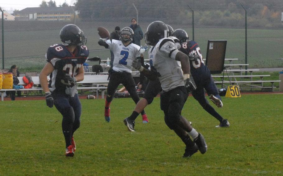 Hohenfels quarterback Clayton Pinheiro finds Jeantony Saintmelus for a fourth-quarter touchdown pass in Hohenfels' 38-28 Division II semifinal win Saturday, Oct. 26, at Bitburg, Germany.