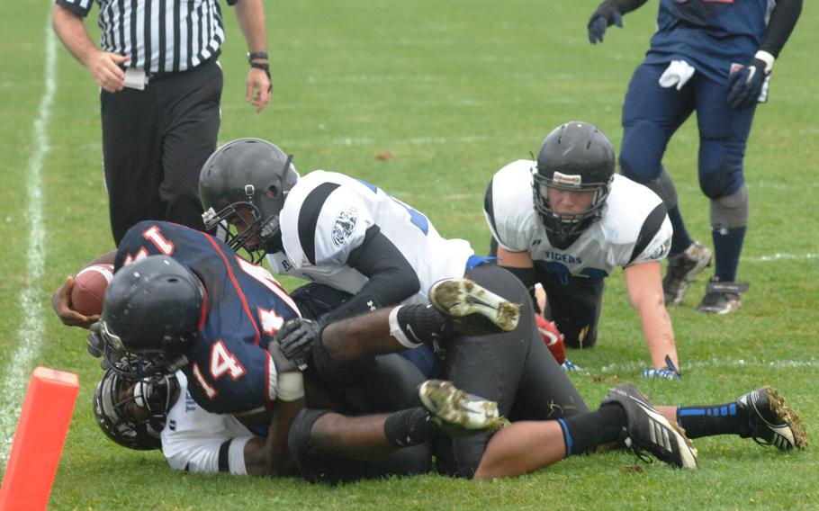 Hohenfels defenders stop Bitburg running back Larry Jackson short of a touchdown in Hohenfels' 38-28 Division II semifinal win Saturday, Oct. 26, at Bitburg, Germany.