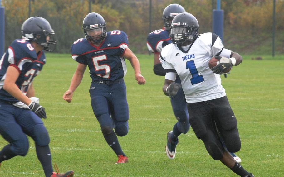 Hohenfels wide receiver Jeantony Saintmelus runs against three Bitburg defenders in Hohenfels' 38-28 Division II semifinal win Saturday, Oct. 26, at Bitburg, Germany.