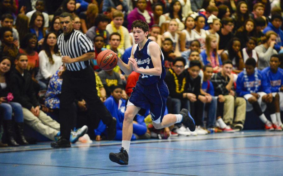 Bitburg's Colton Thomas pushes the ball up the court against Ramstein Friday night at Ramstein, Germany.
