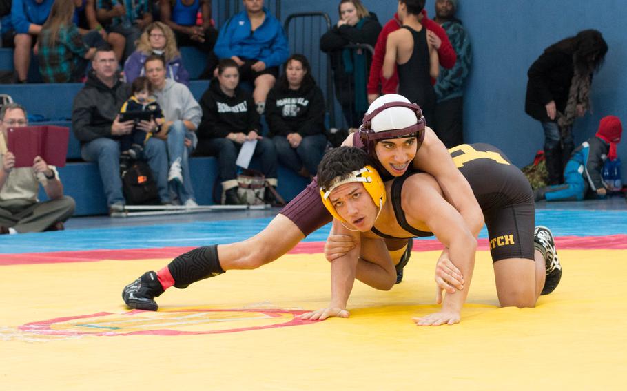 Johnathan Brabazon from Patch and Eduardo Castaneda of Vilseck look to their coaches for advice during their midday match. Brabazon took third place with his victory over Castaneda, outscoring his opponent 18-3.