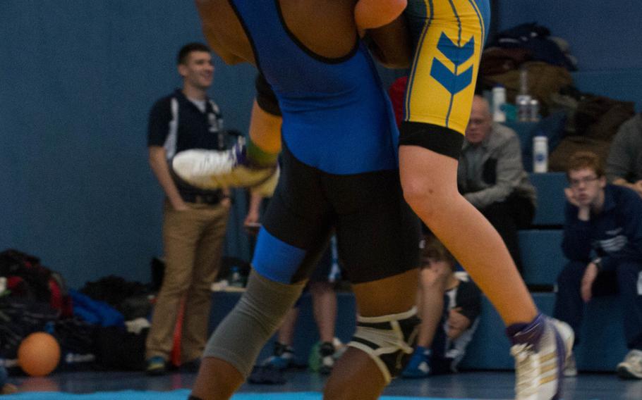 Marcus Dudley from Hohenfels lifts Ansbach wrestler Tristian Linan before taking him to the ground during their battle for first place in the 152-pound weight class. Dudley went undefeated and claimed the title of champion, while Llinan suffered his only loss on the day to the Hohenfel Tiger.
