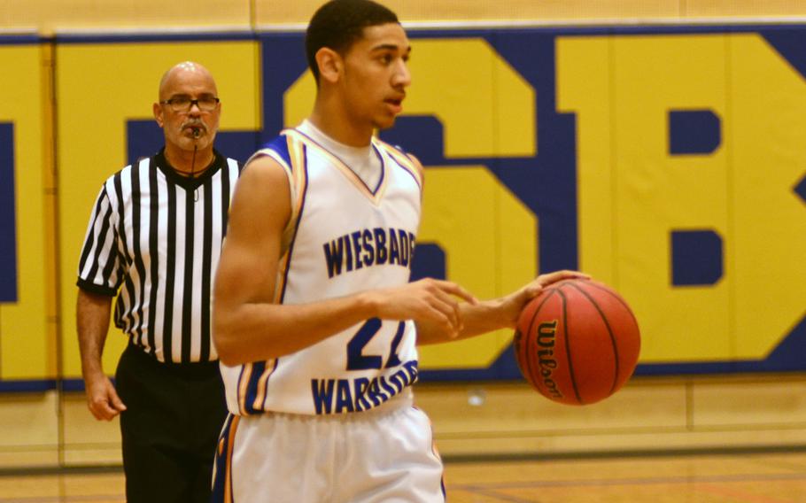Wiesbaden's' Kelsey Thomas looks for opportunities down the court to score two of his 17 points.  Thomas was the Warriors' high scorer during the matchup with Kaiserslautern.