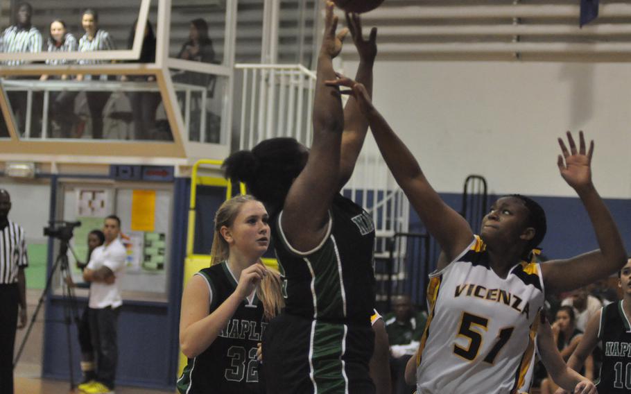 Naples senior Shanice Alexander shoots over Vicenza's Kianna Grant in the Willdats' 34-26 victory over the Cougars on Friday night.