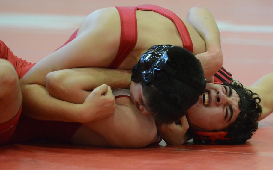 Aviano's Manny Gamboa pins Emil Jurgens of American Overseas School of Rome Saturday, during a match at Aviano Air Base, Italy. Gamboa pinned Jurgens in 1:49, which earned him first for his weight class. 