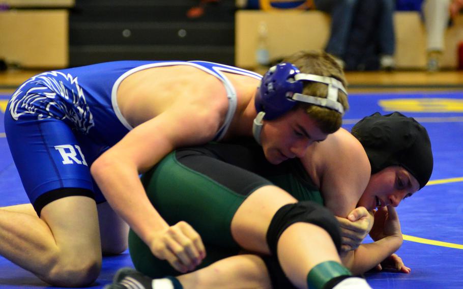 Ramstein sophmore Joey Fortunato contemplates his next move against SHAPE junior Madeline Poisson Saturday, in the 126-pound category at a competition in Wiesbaden, Germany.  Fortunato was able to beat Poisson with a pin at 51 seconds on the clock and went on to place first in his weight class.  Fortunato was last year's DODDS European wrestling champion in the 106-pound category, 