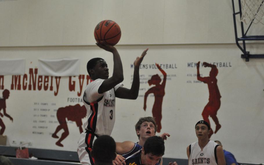 Aviano's Jamal Thomas puts up a shot in the first half Friday night in the Saints' 45-41 loss to Sigonella.