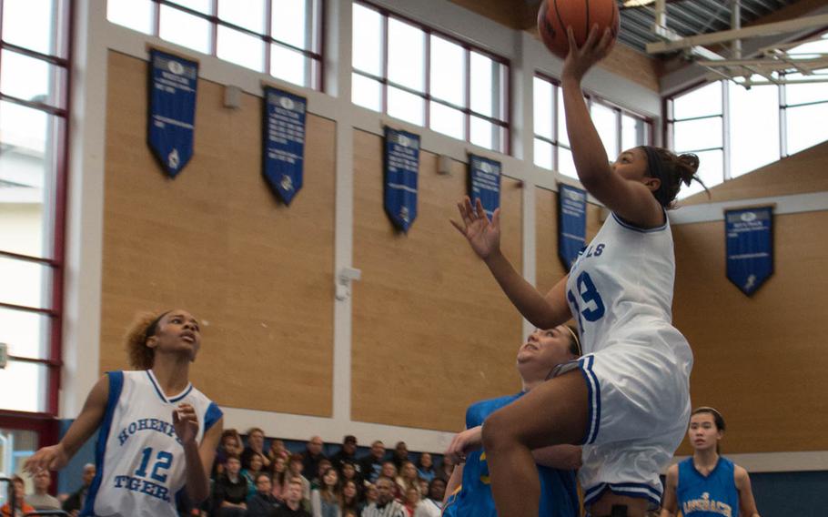 Hohenfels' Tamia McDaniels goes for two points and ultimately scores 11 points  Saturday against Ansbach during a game played at Hohenfels, Germany. The Tigers beat the  Cougars 35-33.