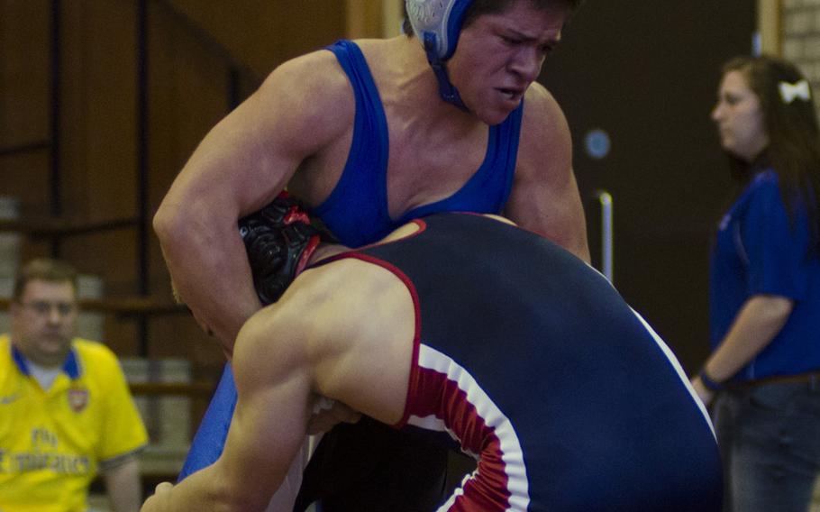 Brussels' Aaron Norton grapples with Lakenheath's Zac Adamson Saturday, Feb. 1, 2014 , during the match for first place in the 138-pound class at RAF Lakenheath, England. Brussels took fifth at the meet.