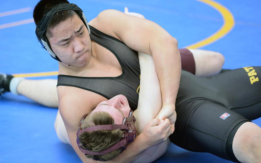 Patch's Steven Ashbaugh, top, defeated Baumholder's Gabe Russell in a 182-pound match in first round action on the first day of the DODDS-Europe wrestling championships in Wiesbaden, Germany, Friday, Feb. 14, 2014.