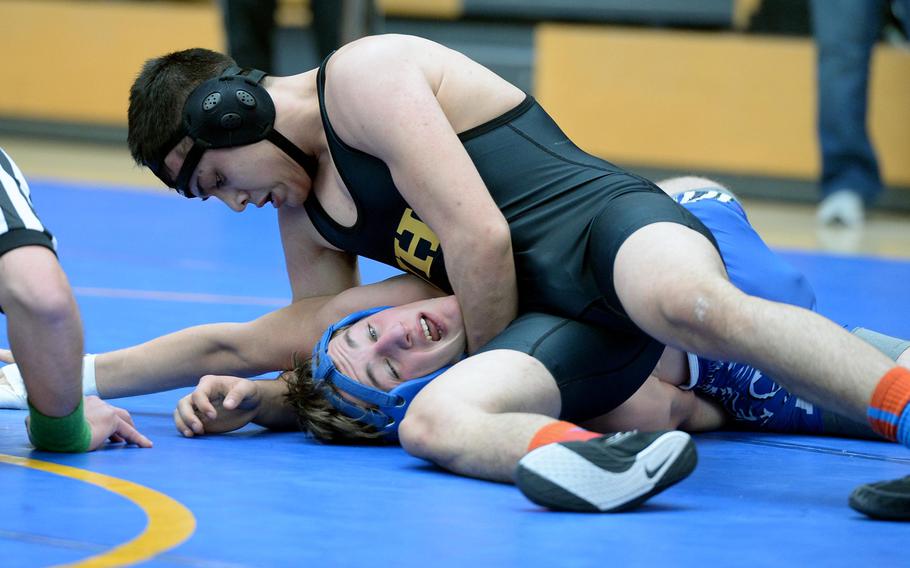 Vicenza's Joseph O'Hagan, top, beat Ramstein's Thomas Wilby in a 145-pound match in first round action on the first day of the DODDS-Europe wrestling championships in Wiesbaden, Germany, Friday, Feb. 14, 2014.





