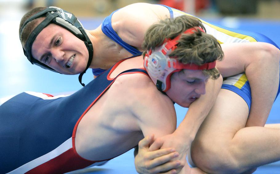 In a 132-pound match Wiesbaden's Caleb Magowan, top, beat Lakenheath's Richard Greszler in first round action on the first day of the DODDS-Europe wrestling championships in Wiesbaden, Germany, Friday, Feb. 14, 2014.





