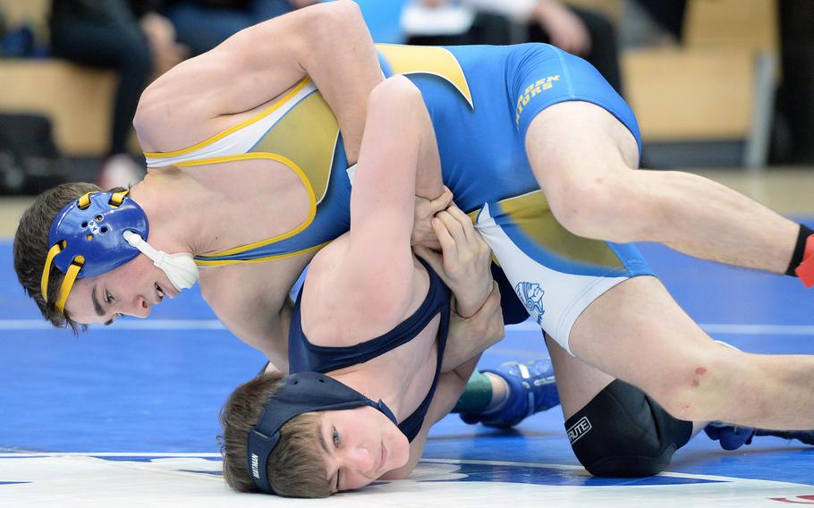 Wiesbaden's Brendan Sturman, top, defeated Brandon Beaumont of Bitburg in a 126-pound semifinal at the DODDS-Europe wrestling championships in Wiesbaden, Germany, Saturday, Feb. 15, 2014. Sturman was to face Ramstein's Kenny Berry in the championship match.