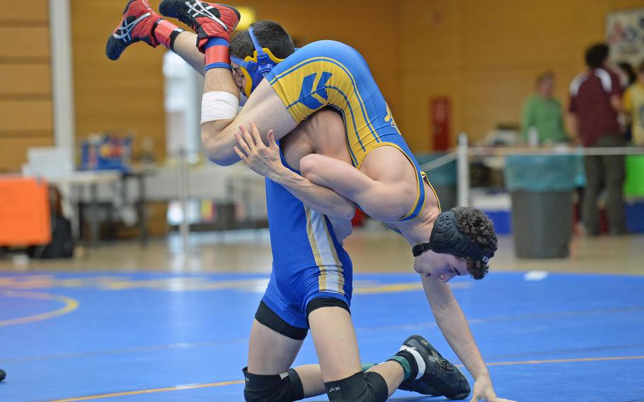 Wiesbaden's Matthew Hall, left, and Ansbach's Shawn McDonald grapple in a 132-pound semifinal match at the DODDS-Europe wrestling championships in Wiesbaden, Germany, Saturday, Feb. 15, 2014. Hall won and was to meet Patch's Robert Call in the title match.