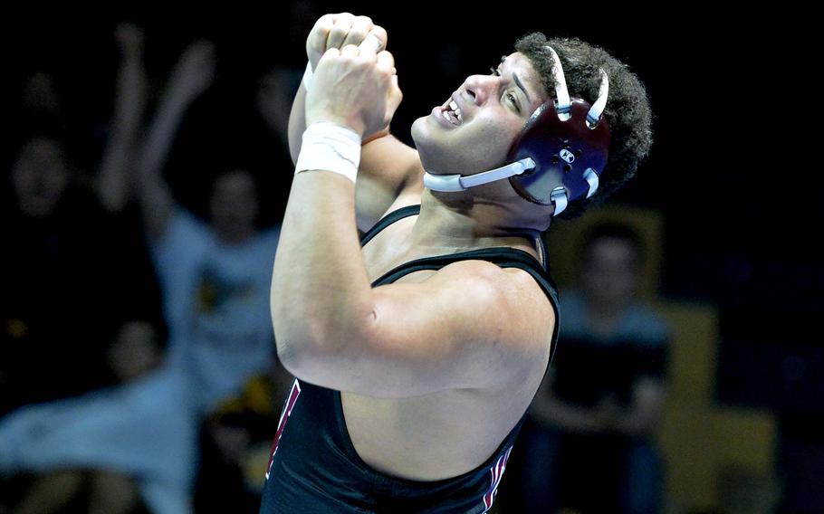 Vilseck's Armando Saldana reacts after defeating Ramstein's Christian Biacan for the 285-pound title at the DODDS-Europe wrestling championships in Wiesbaden, Germany, Saturday, Feb. 15, 2014.





