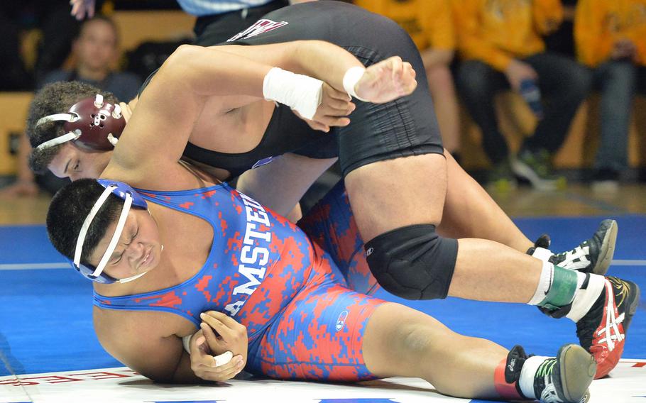 Vilseck's Armando Saldana defeated Ramstein's Christian Biacan for the 285-pound title at the DODDS-Europe wrestling championships in Wiesbaden, Germany, Saturday, Feb. 15, 2014.





