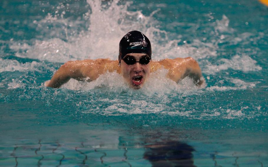 Kaiserslautern's Everett Plocek grinds out a win in the 17-to 19-year-old boys 100-meter butterfly Saturday, Feb. 15, 2014, at the European Forces Swim League championships in Eindhoven, Netherlands. 