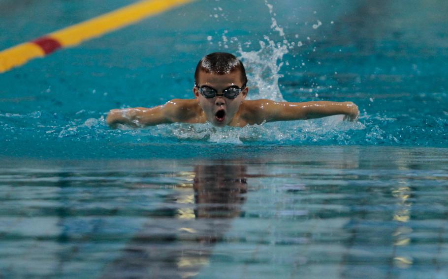 Sigonella's CJ Davis, 8, gulps a breath of air on his way to winning the boys 8 and under 50-meter butterfly Saturday, Feb. 15, 2014, at the European Forces Swim League championships in Eindhoven, Netherlands. 