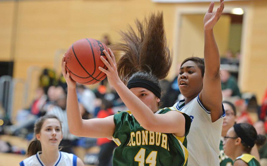 Alconbury's Leila Hall pulls down a rebound in front of Breann Gotel of Hohenfels in Division II action at the DODDS-Europe basketball championships in Wiesbaden, Germany, Wednesday, Feb. 19, 2014. Hohenfels beat Alconbury 31-19.
