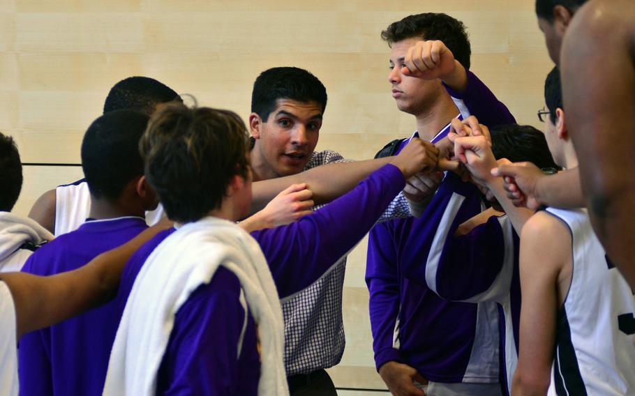 Bahrain head coach Emiliano Herrera pumps his team up during a timeout against Marymount.  Bahrain eventually defeated MMI 54-32.