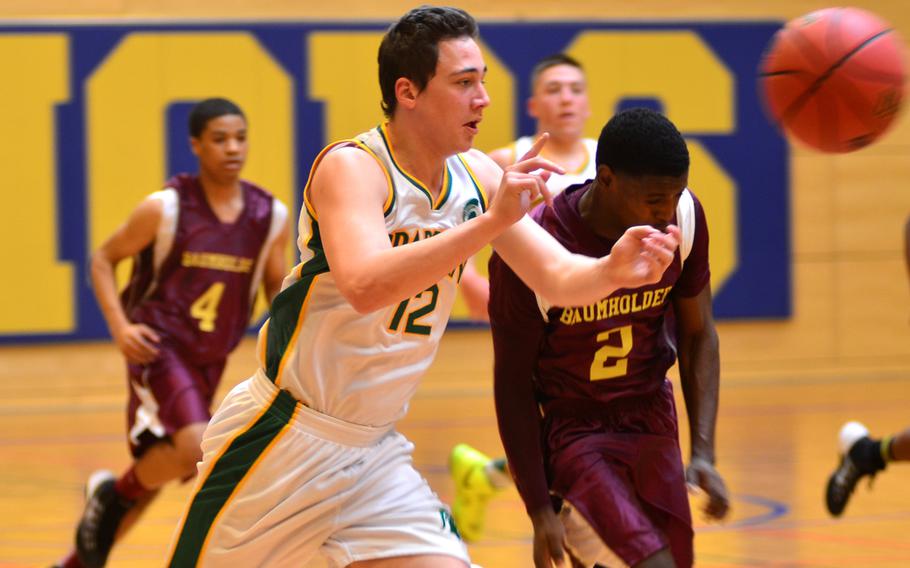 SHAPE Spartans senior Fernando Royo passes the ball against the Baumholder Bucs. The Spartans beat the Bucs 68-28.