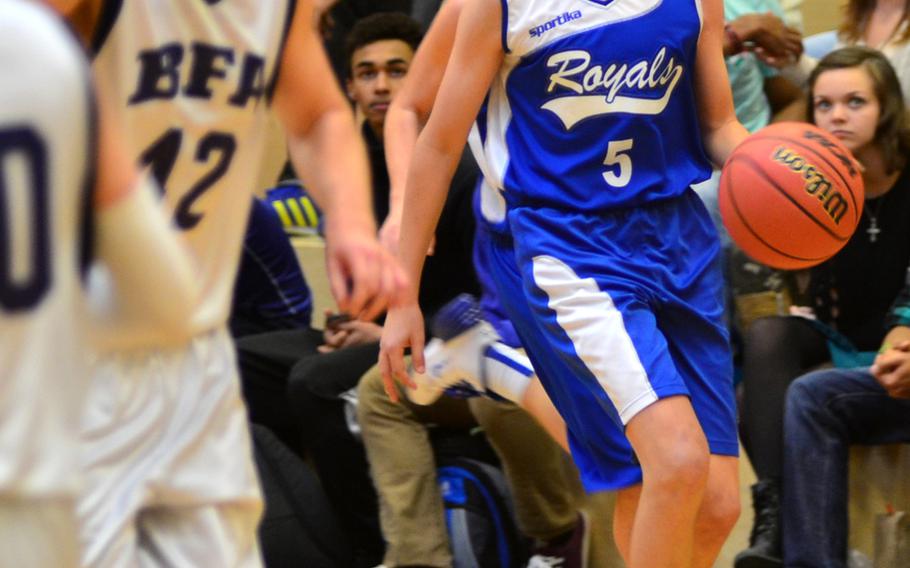 Marymount Royals freshman Miles Centrella dribbles the ball downcourt against BFA Falcons opponents.