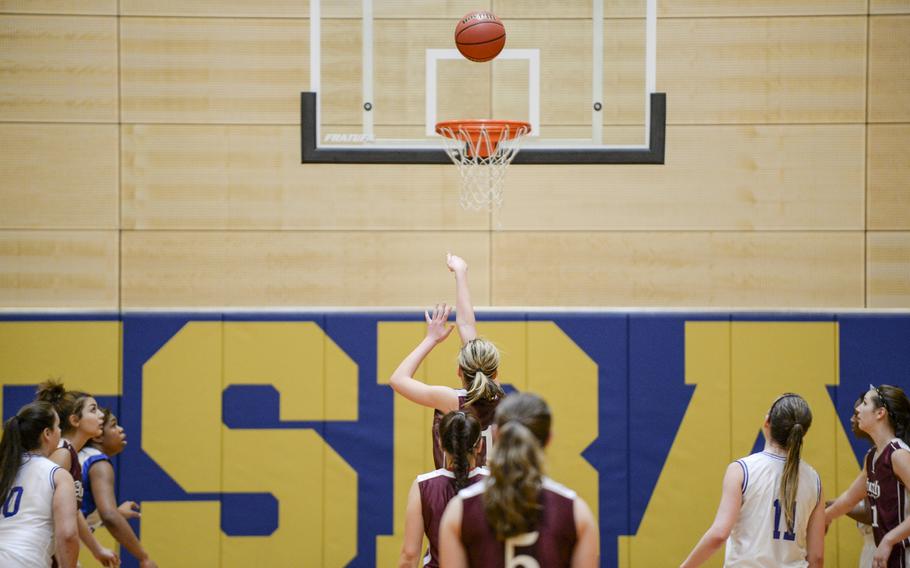 AFNORTH's Eliska Volencova sinks a free throw to put her team up by three to seal their victory against Hohenfels in a DODDS-Europe basketball championships Division III semifinal game Friday, Feb. 21, 2014. 