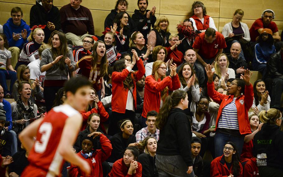 AOSR fans cheer as their team scores in a DODDS-Europe basketball championships Division II semifinal game Friday, Feb. 21, 2014.