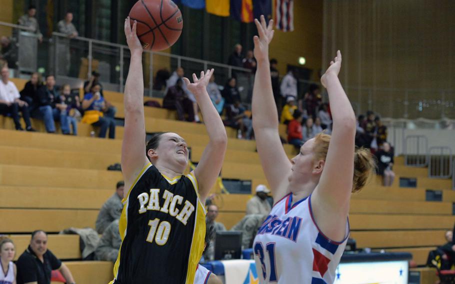 Patch's Rebecca Hess shoots over Ramstein's Katherine Enyeart in a Division I semifinal at the DODDS-Europe basketball championships in Wiesbaden, Germany, Friday Feb. 21, 2014. Patch won 49-36 to advance to Saturday's final.