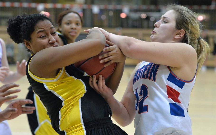 Patch's Breanna Rodriguez-Jeff, left, and Ramstein's Sofia Dinges fight for the ball in a Division I semifinal at the DODDS-Europe basketball championships in Wiesbaden, Germany, Friday Feb. 21, 2014. Patch won 49-36 to advance to Saturday's final.

