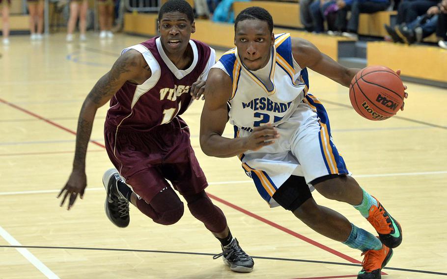 Wiesbaden's Anthony Little drives to the basket against Vilseck's Khayree Files in a Division I semifinal at the DODDS-Europe basketball championships in Wiesbaden, Germany, Friday Feb. 21, 2014. Wiesbaden won 69-50 to advance to Saturday's final against Patch.