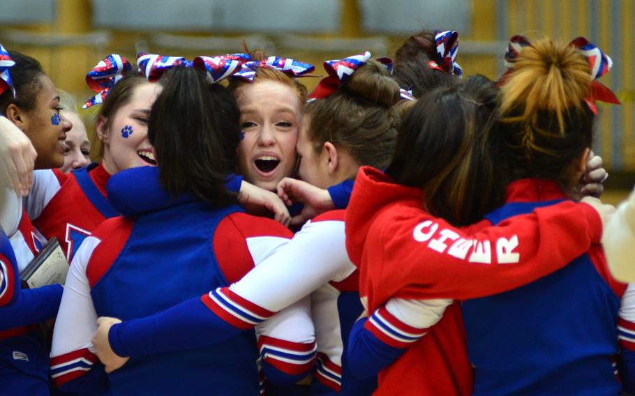 Members of the Ramstein Royals cheer squad react to the announcement they had won first place in Division I at the DODDS-Europe cheerleading championships in Wiesbaden, Germany, Saturday, Feb. 22, 2014.  
