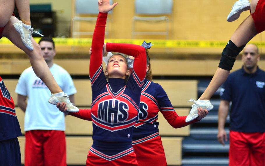 Members of the Menwith Hill Mustangs cheer squad perform at the DODDS-Europe cheerleading championships in Wiesbaden, Germany, Saturday. The Mustangs won the Division III 2014 Cheer competition. 