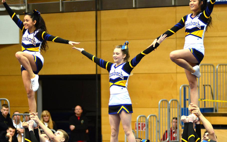 Members of the Ansbach Cougars cheer squad perform at the DODDS-Europe cheerleading championships in Wiesbaden, Germany, Saturday, Feb. 22, 2014. The Cougars won first place for Division II in the 2014 Cheer competition. 