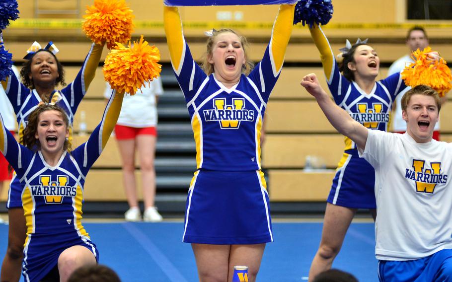 The Wiesbaden Warriors cheer squad performs part of their 2 minute routine at the DODDS-Europe cheerleading championships in Wiesbaden, Germany, Saturday Feb. 22, 2014.  