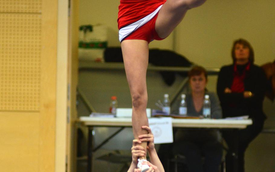 The Kaiserslautern Raiders cheer squad performs part of their 2 minute routine at the DODDS-Europe cheerleading championships in Wiesbaden, Germany, Saturday Feb 22, 2014.  The Raiders received the spirit award for Division I.