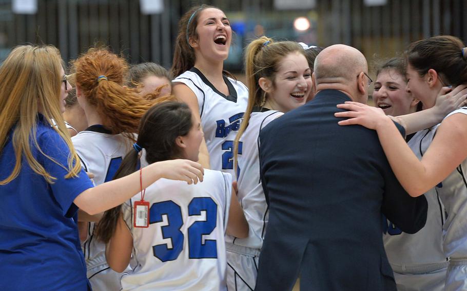 The Brussels Brigands celebrate their 38-31 overtime win over Sigonella in the Division III girls final at the DODDS-Europe basketball championships in Wiesbaden, Germany, Saturday, Feb. 22, 2014.