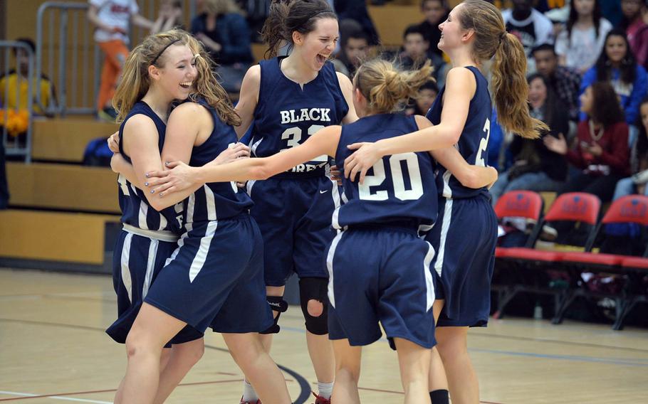 The Black Forest Academy Falcons celebrate their Division II title after defeating AFNORTH 19-13 at the DODDS-Europe basketball championships in Wiesbaden, Germany, Saturday, Feb. 22, 2014. 
