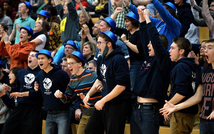 The Black Forest Academy's fans cheer their team on to the title in the Division II final at the DODDS-Europe basketball championships in Wiesbaden, Germany, Saturday, Feb. 22, 2014. BFA won 19-13.
