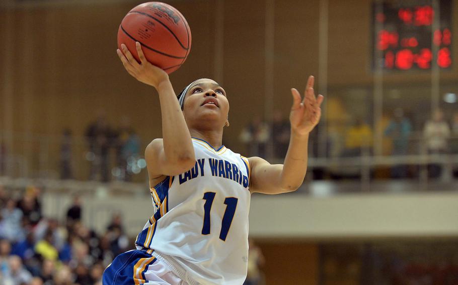 Wiesbaden's Cierra Martin ends a fast break with a basket in the Division I title game at the DODDS-Europe basketball championships in Wiesbaden, Germany, Saturday, Feb. 22, 2014. Wiesbaden beat Patch 40-17.