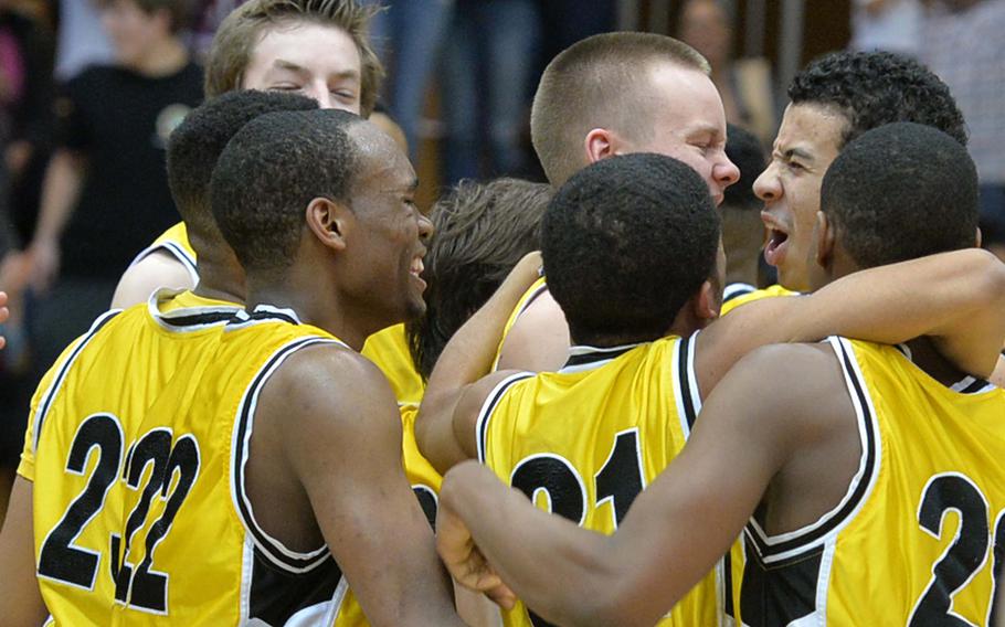 The Patch Panthers celebrate the defense of their Division I title after defeating Wiesbaden 60-56 at the DODDS-Europe basketball championships in Wiesbaden, Germany, Saturday, Feb. 22, 2014. 