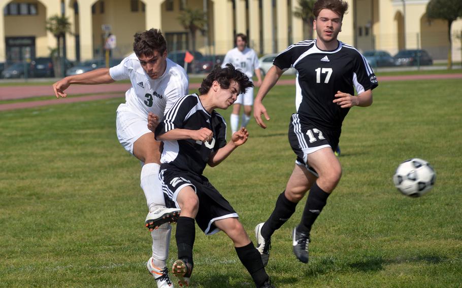 Joseph Cianciaruso of Naples, left, fires past Vicenza defenders during a March 15, 2014, match in Naples. The Wildcats defeated the Cougars 4-1 in the match, the first of the season. 