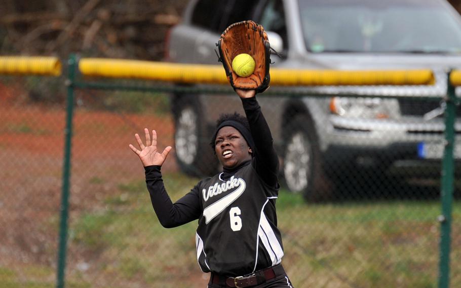 Vilseck's Brittany Richardson makes a leaping catch for an out  in the first game of a doubleheader at Ramstein, Germany, Saturday, March 22, 2014. Ramstein beat the Falcons 15-1 in both team's season opener.