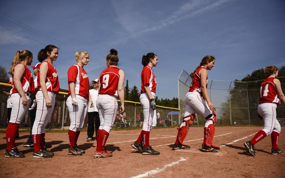Kaiserslautern softball players lineup to shake hands with Baumholder after the first game of a double header against Baumholder Saturday, March 29, 2014. Kaiserslautern won the game 19-2.
