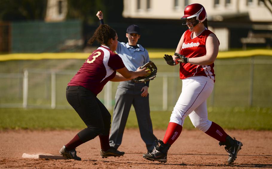 Baumholder's Faith Diaz catches the ball to force Kaiserslautern's Callie Hood out in the first game of a double header Saturday, March 29, 2014 at Kaiserlautern, Germany.