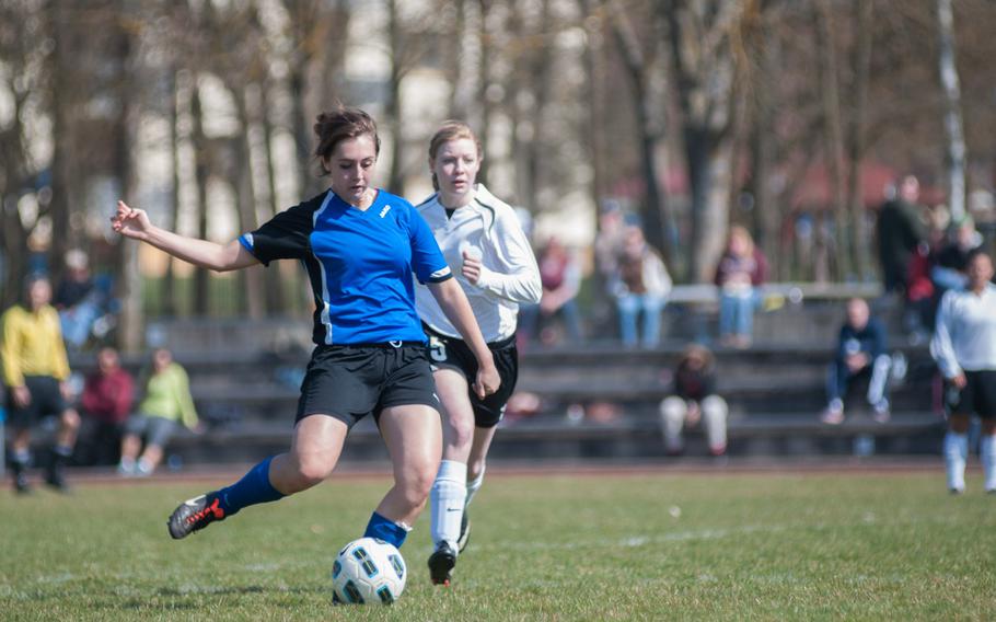 Hohenfels' Taylor Gamble gets past Maggie Clearwater of Vilseck during a game Saturday, March 29, 2014, at Vilseck, Germany. The Tigers won 4-3. 