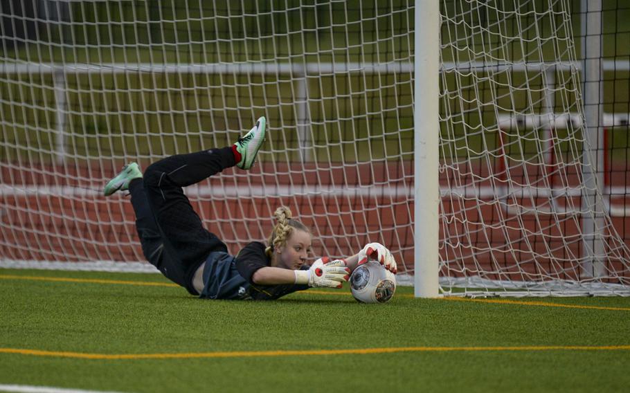 Kaiserslautern's Montana Staab makes a diving save in the first half of play against Ramstein Thursday night, April 3, 2014.