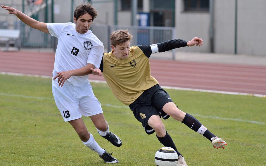 Ramstein's Deven Branham, left, and Patch's Christian Harvey fight for a ball during a game in Ramstein, Friday, April 18, 2014. The game ended 0-0.

