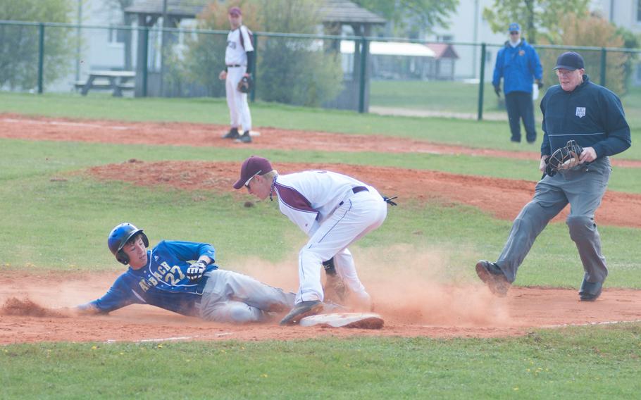 Ansbach's Brandon Piccinini slides into third as Baumholder's Taylor Moore tries to get a tag out during a doubleheader Saturday at Ansbach, Germany. Ansbach took both games 17-0, 13-2.
